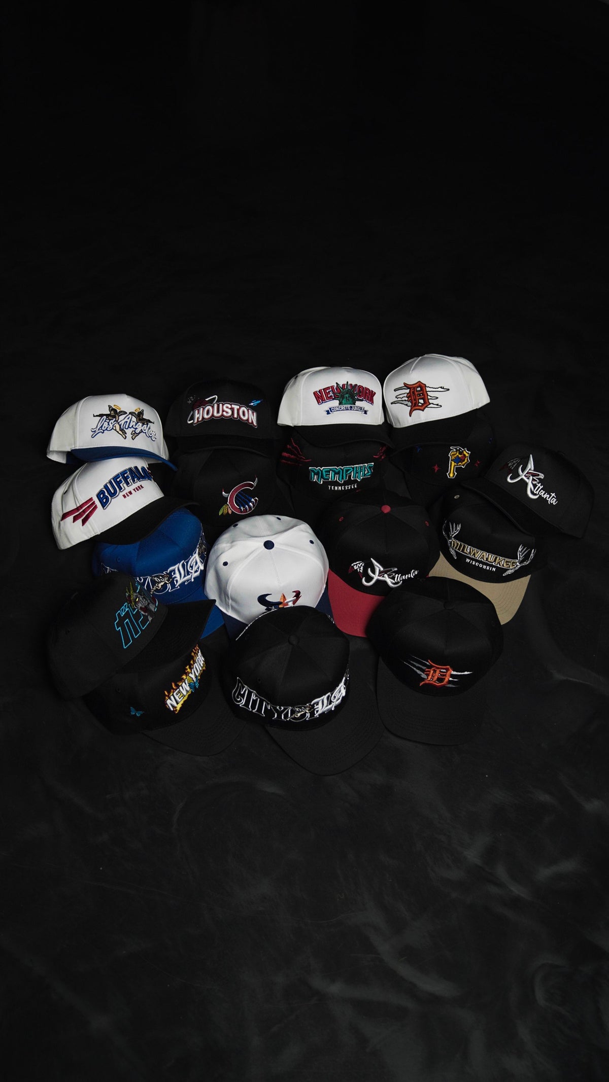 Stack of MADHOURS snapbacks in low light